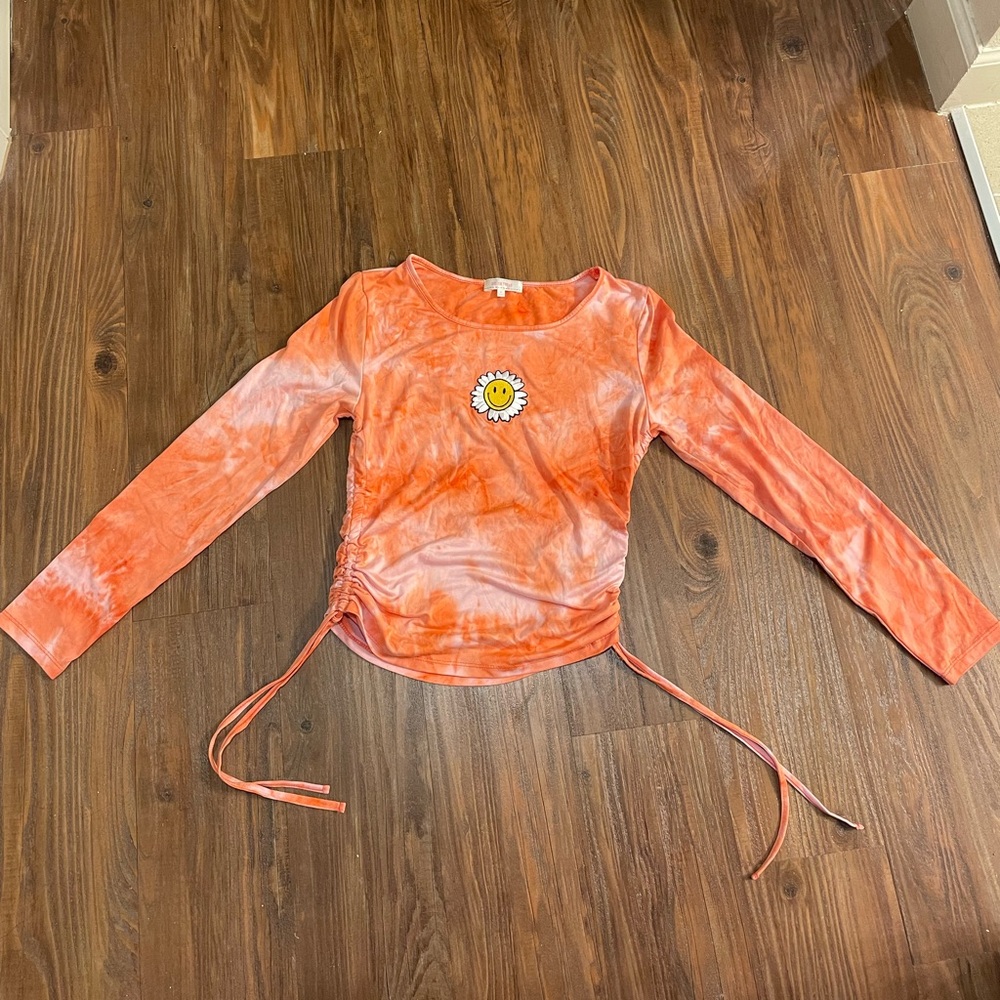 Cute pink/orange shirt with sunflower on the front. Size M